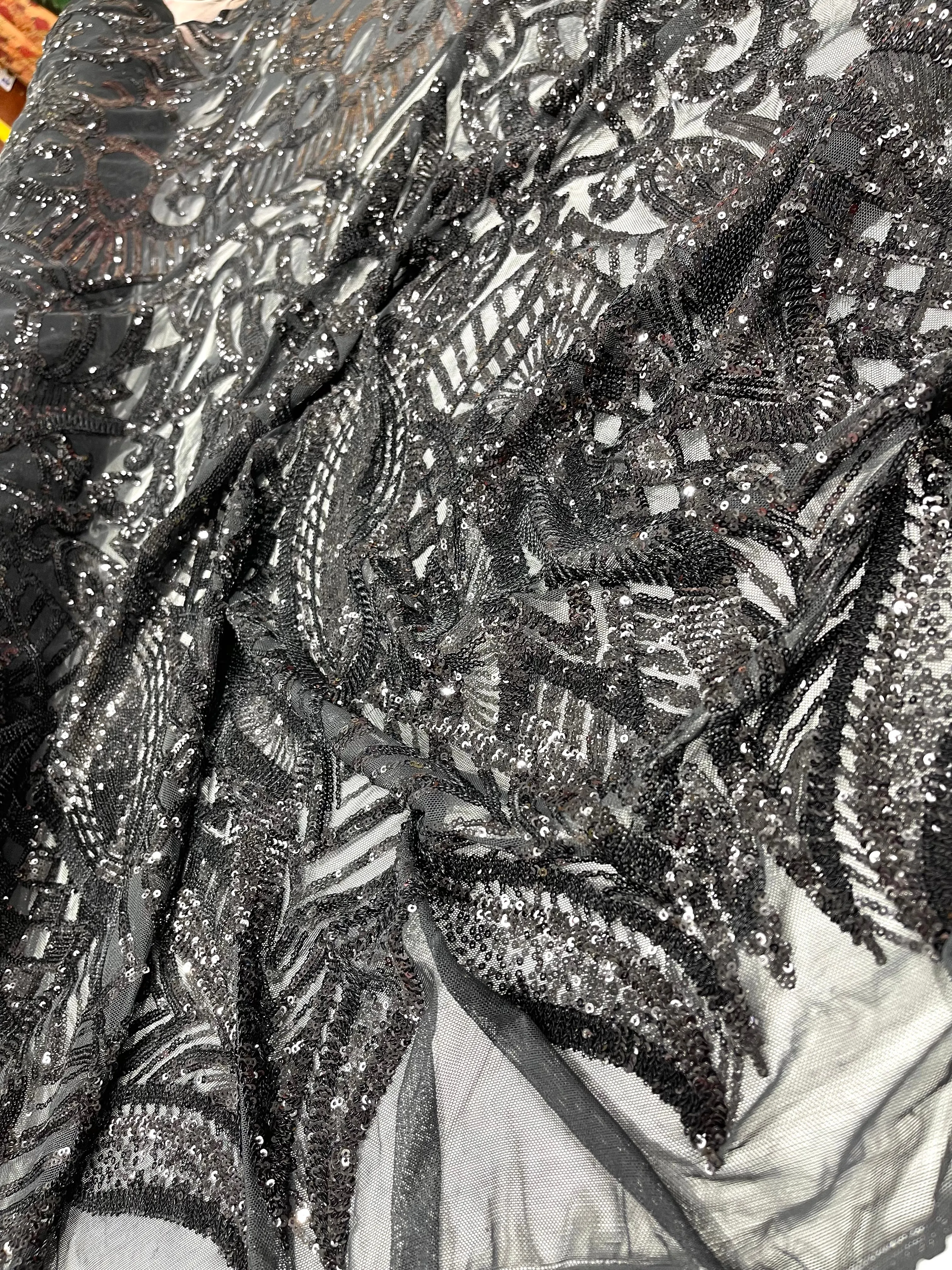 Black royalty design on a 4 way stretch mesh-prom-sold by the yard.