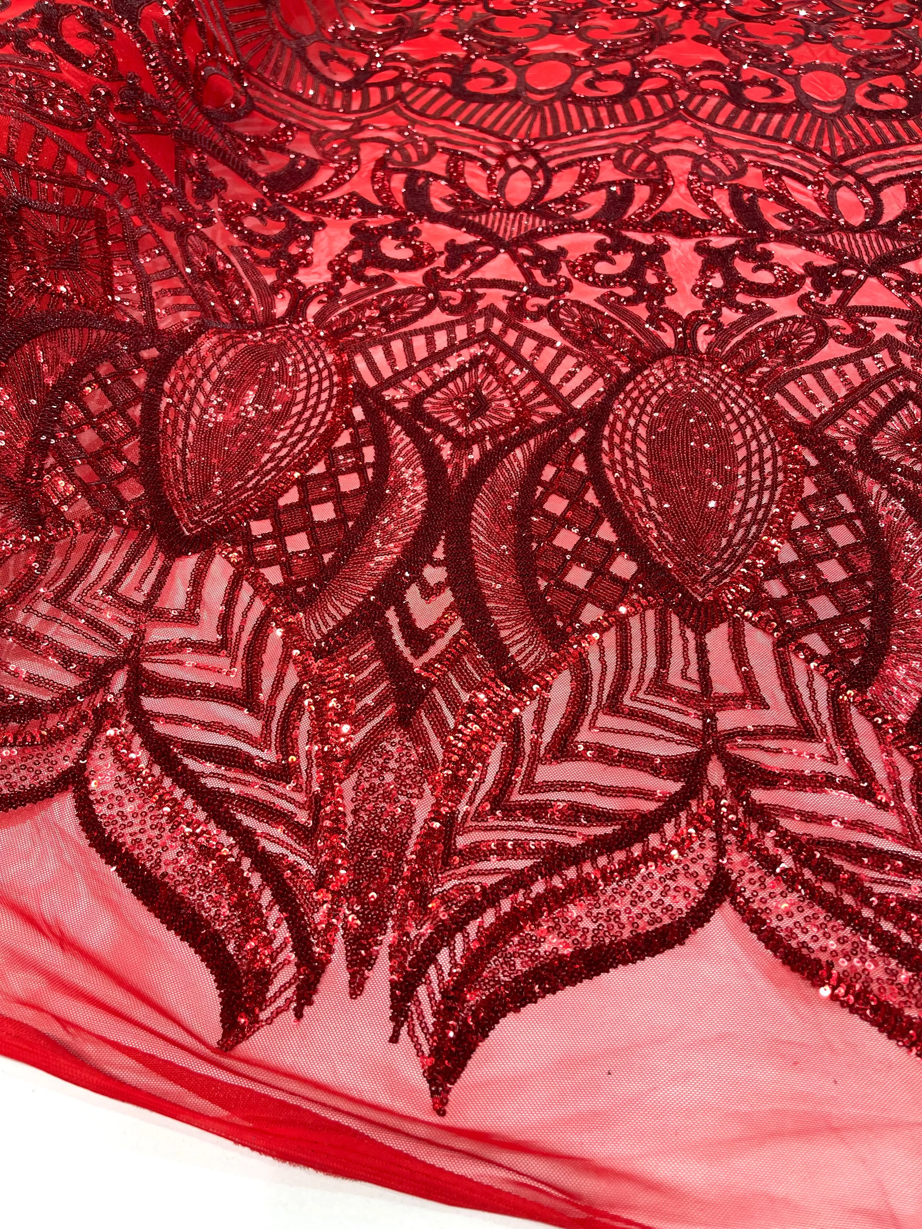 Red royalty design on a 4 way stretch mesh-prom-sold by the yard.