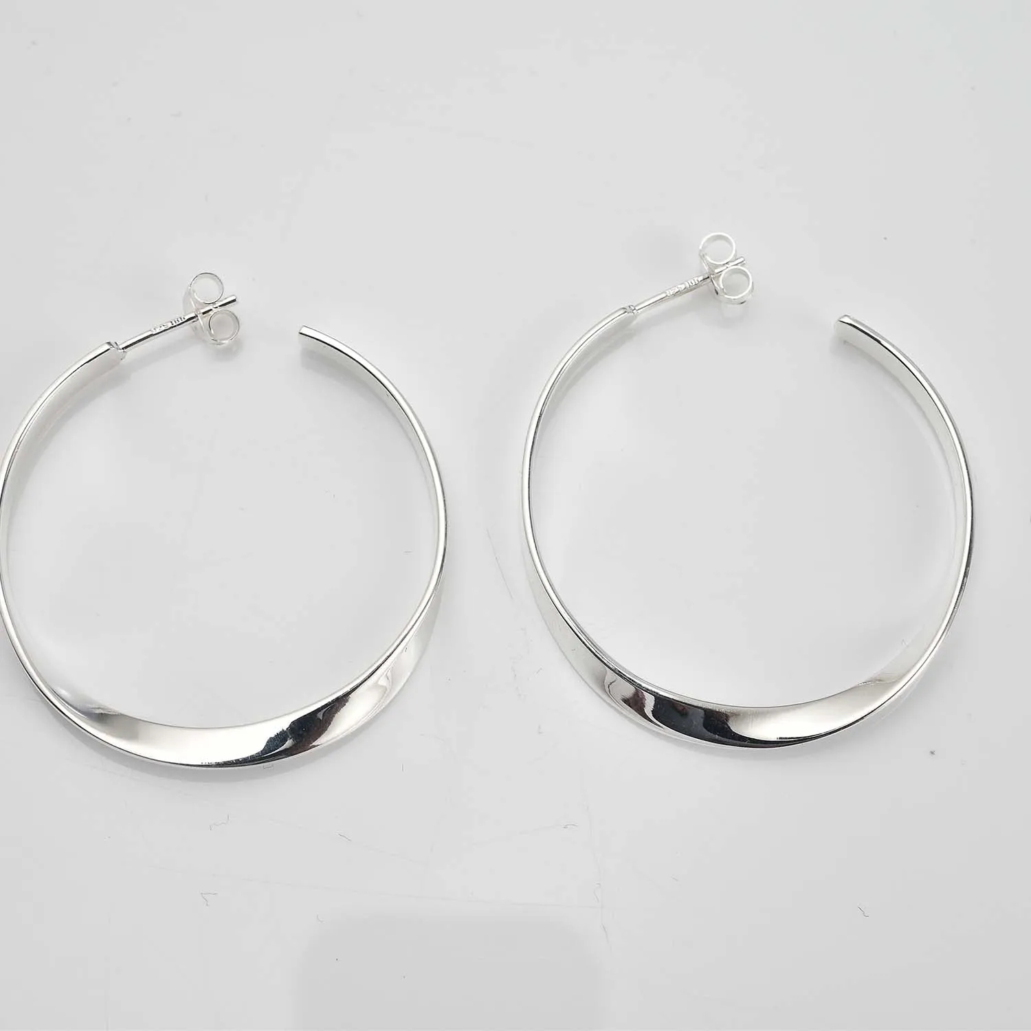 Sleek Horizon Twist Hoops