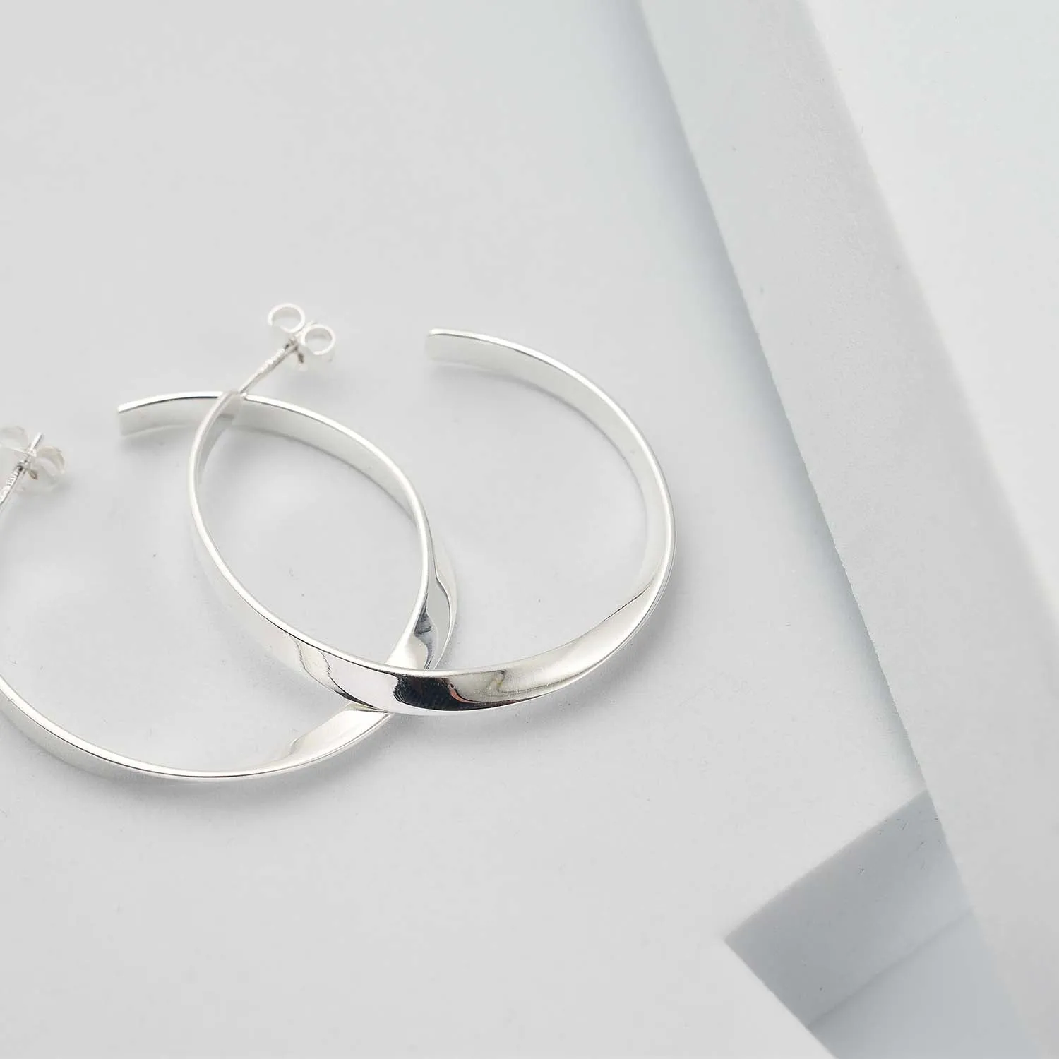 Sleek Horizon Twist Hoops