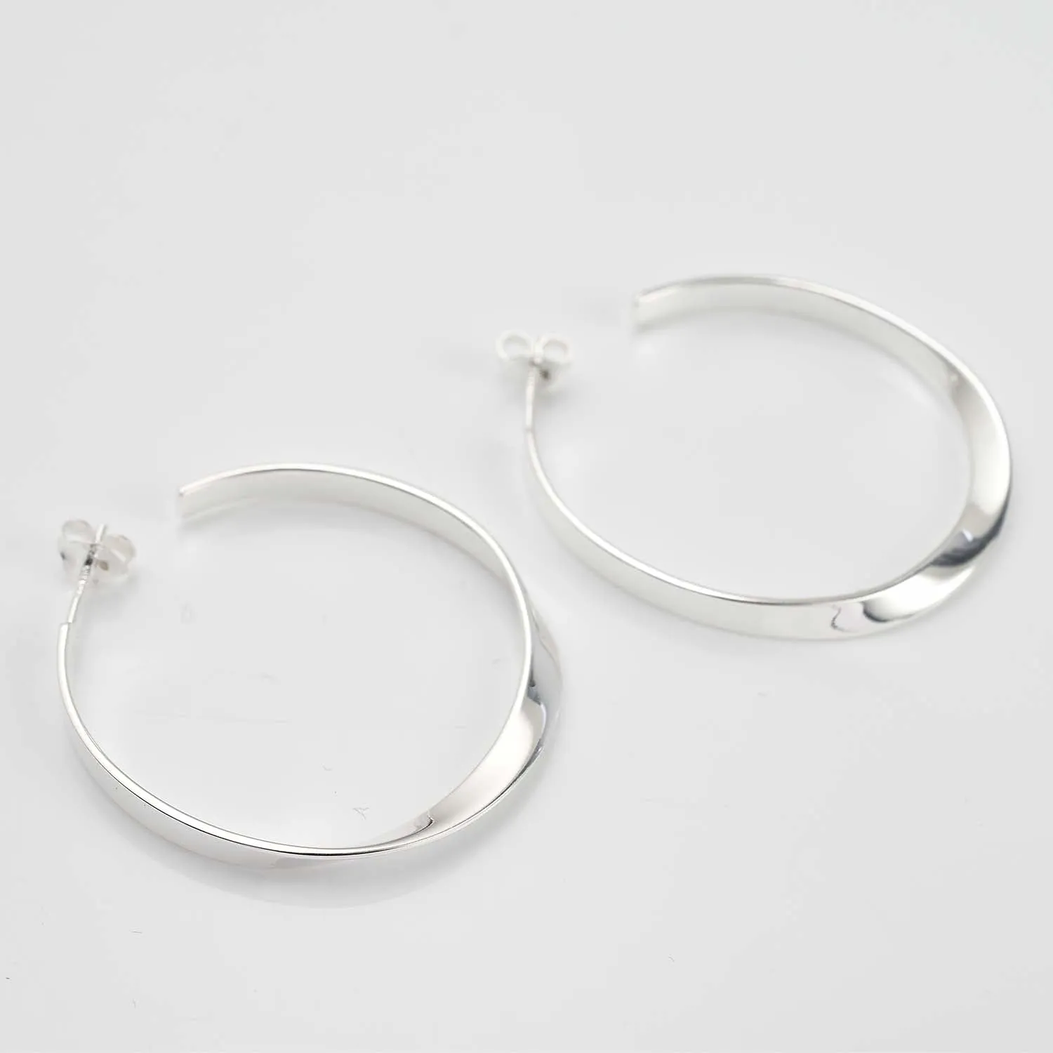 Sleek Horizon Twist Hoops