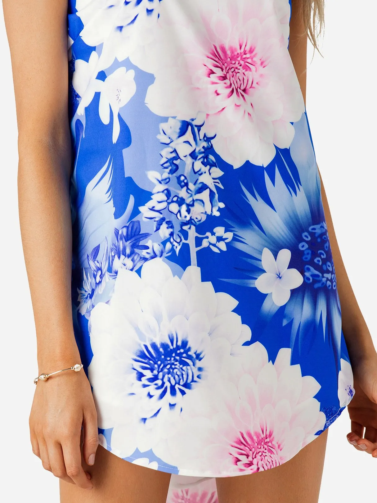 Wholesale Blue Sleeveless Floral Print Curved Hem Mini Dress